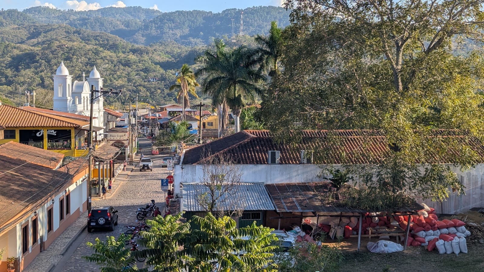 View across rooftops and hills in Copan Ruinas