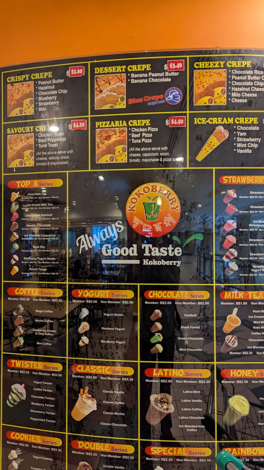 A bubble tea and crepe shop menu board priced in Brunei dollars