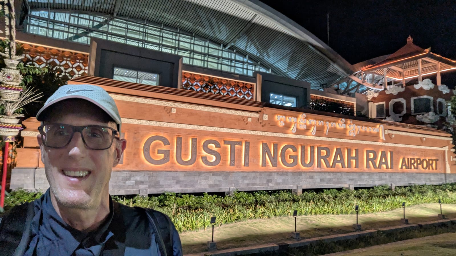 Selfie outside Gusti Ngurah Rai Airport in Denpasar, Bali, at night