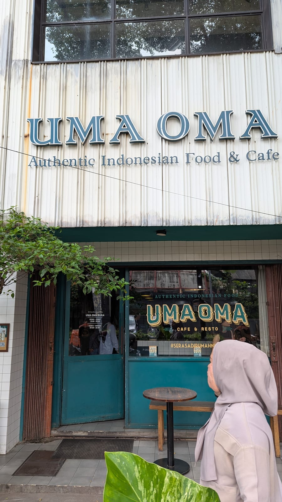 Uma Oma Cafe restaurant sign in Jakarta