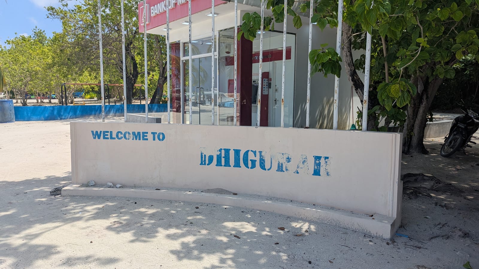 Welcome to Dhigurah sign outside the Bank of Maldives building