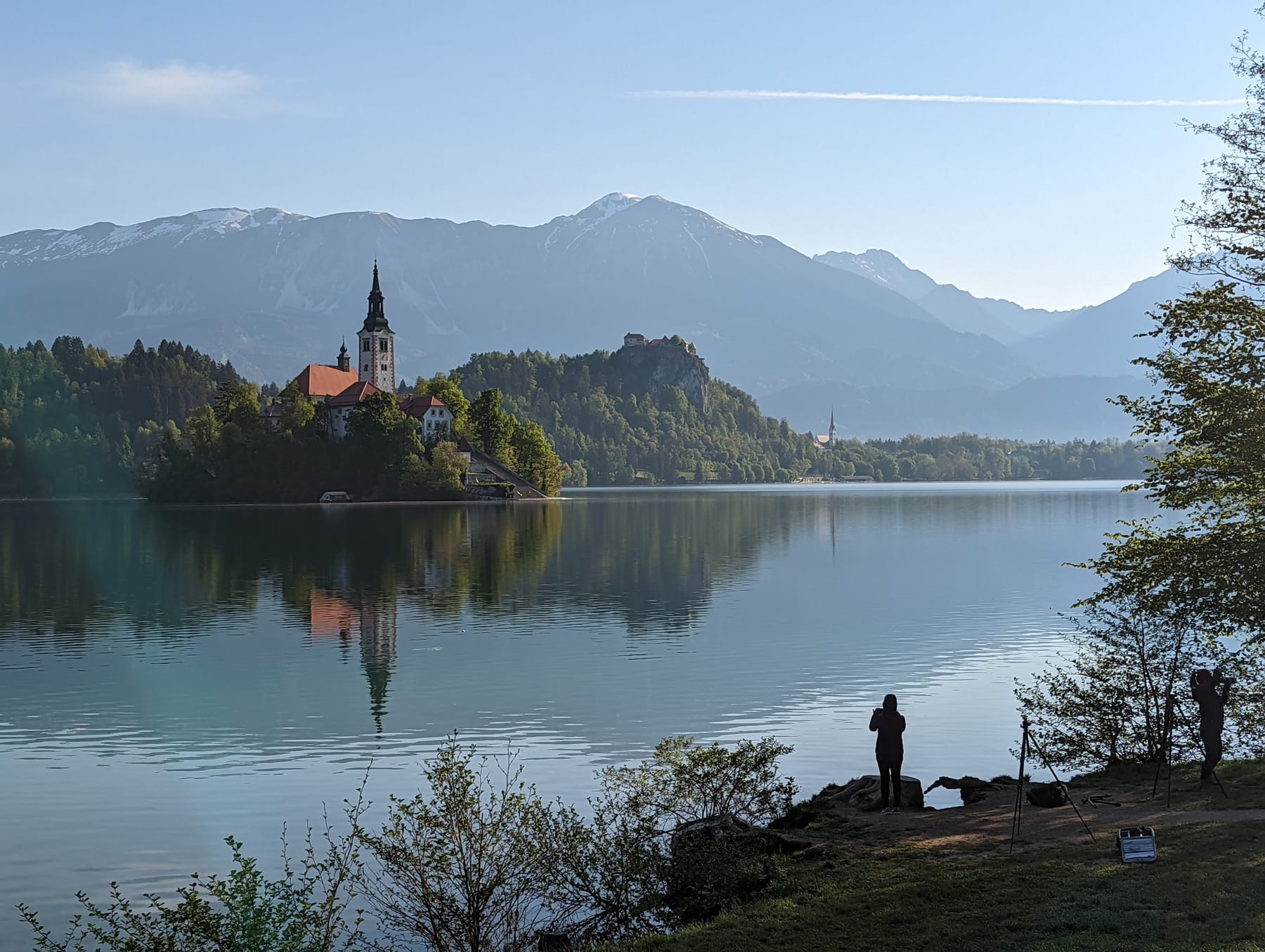 Misty morning view of Lake Bled island from the shore